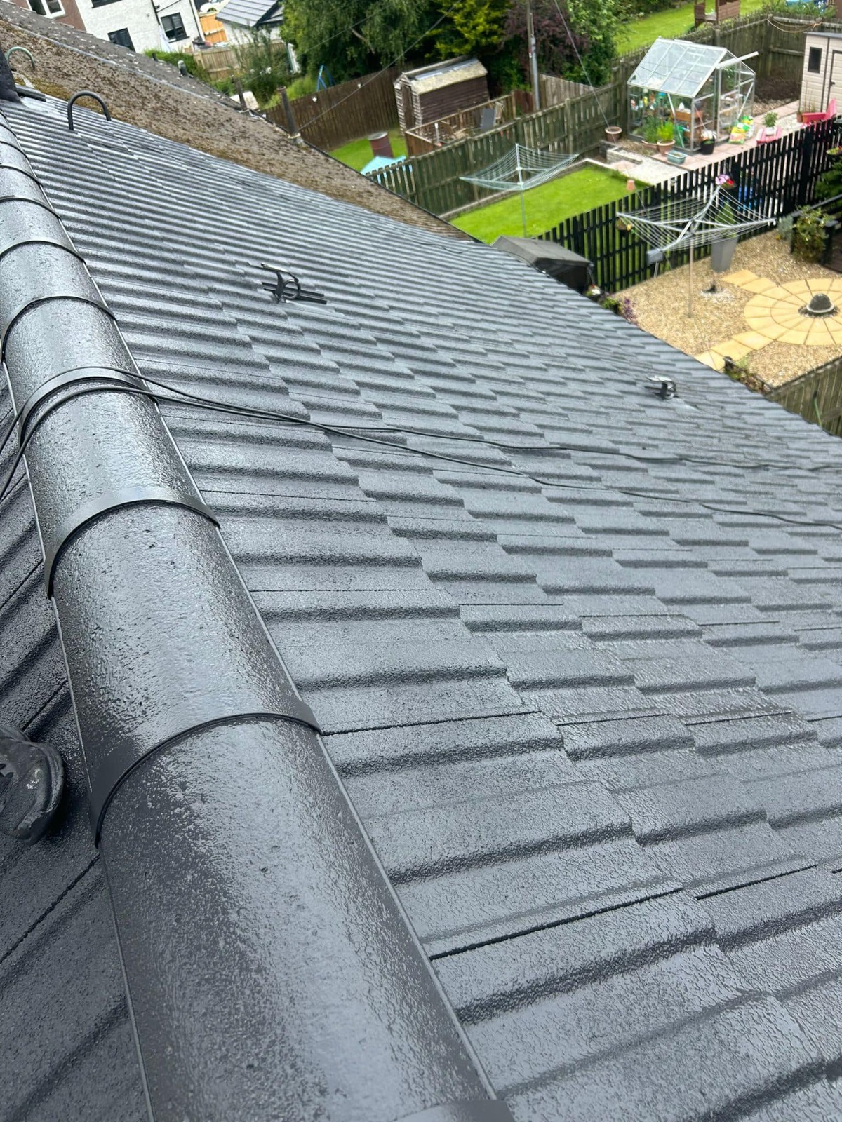 Gray slate roof after cleaning treatment showing restored appearance - Easy-Sprayaway Scotland