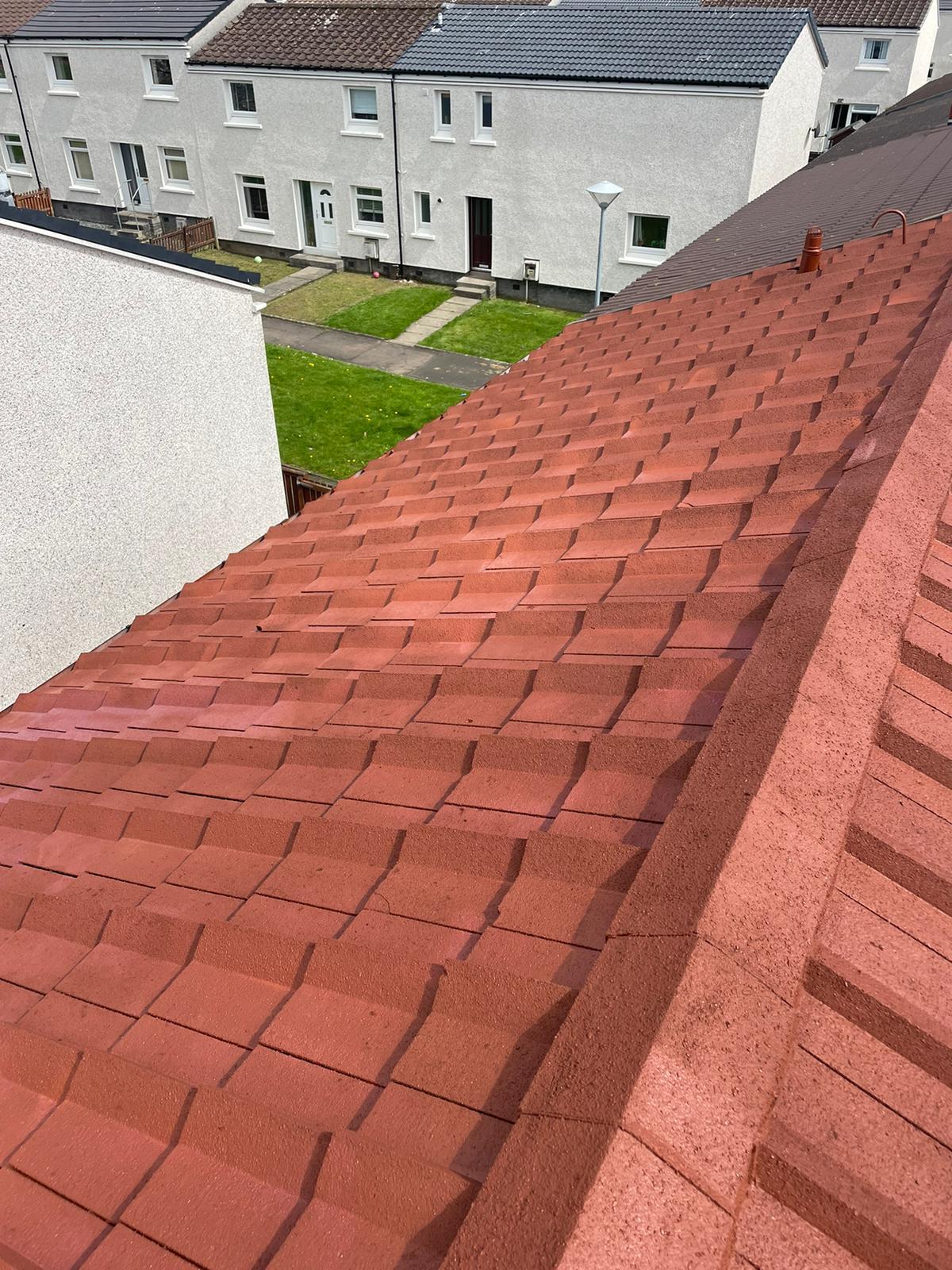 Red tiled roof after professional cleaning showing pristine condition - Easy-Sprayaway Scotland